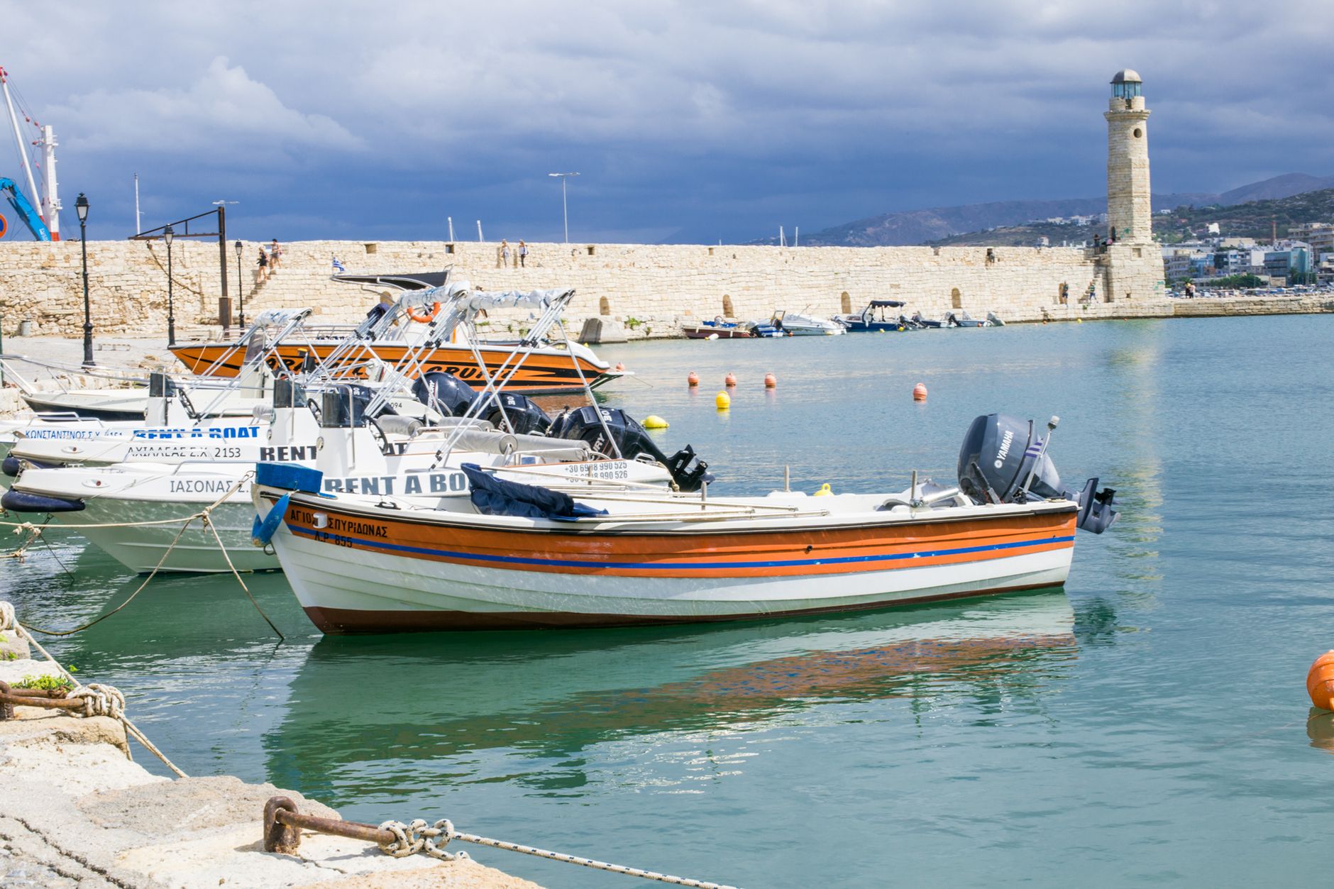 Boat Excursions Rethymno white speedboats docked on the port