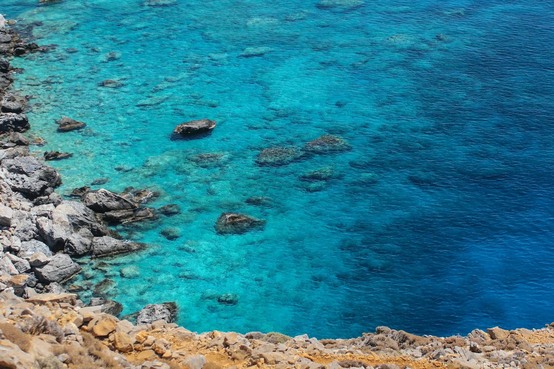 photo of rocky shore during daytime